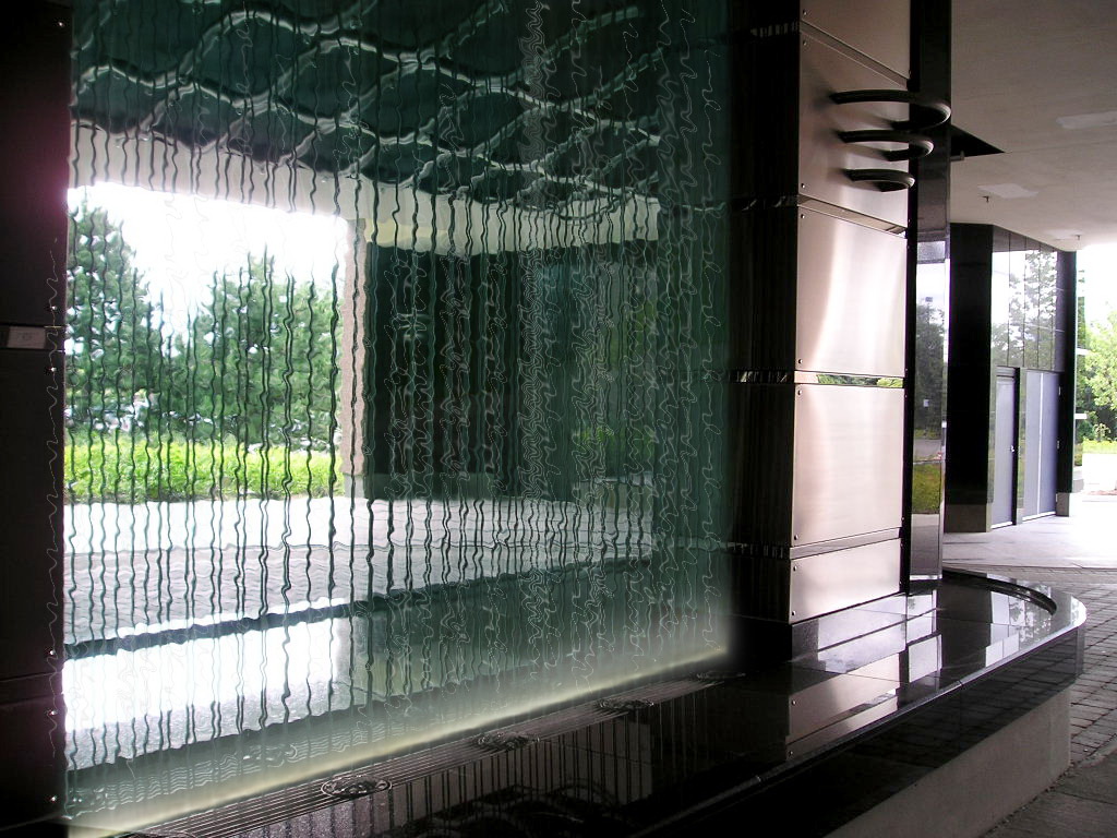 The water wall  The water wall features stainless provides glistening steel cables amplified with the streaming water surrounded by polished granite.