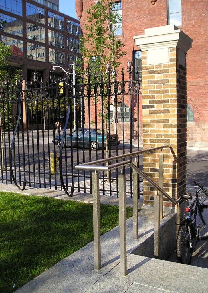 Historic structures are blended with contemporary forms. The existing fence was refurbished and reinstalled to reflect the history of the site.