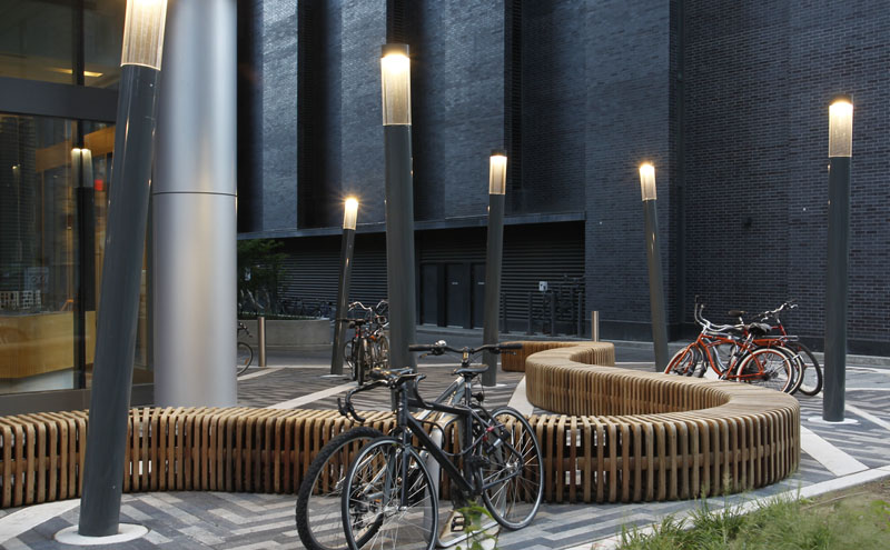 A curving bench creates a unique and memorable entrance plaza for the many pedestrians on Charles Street.